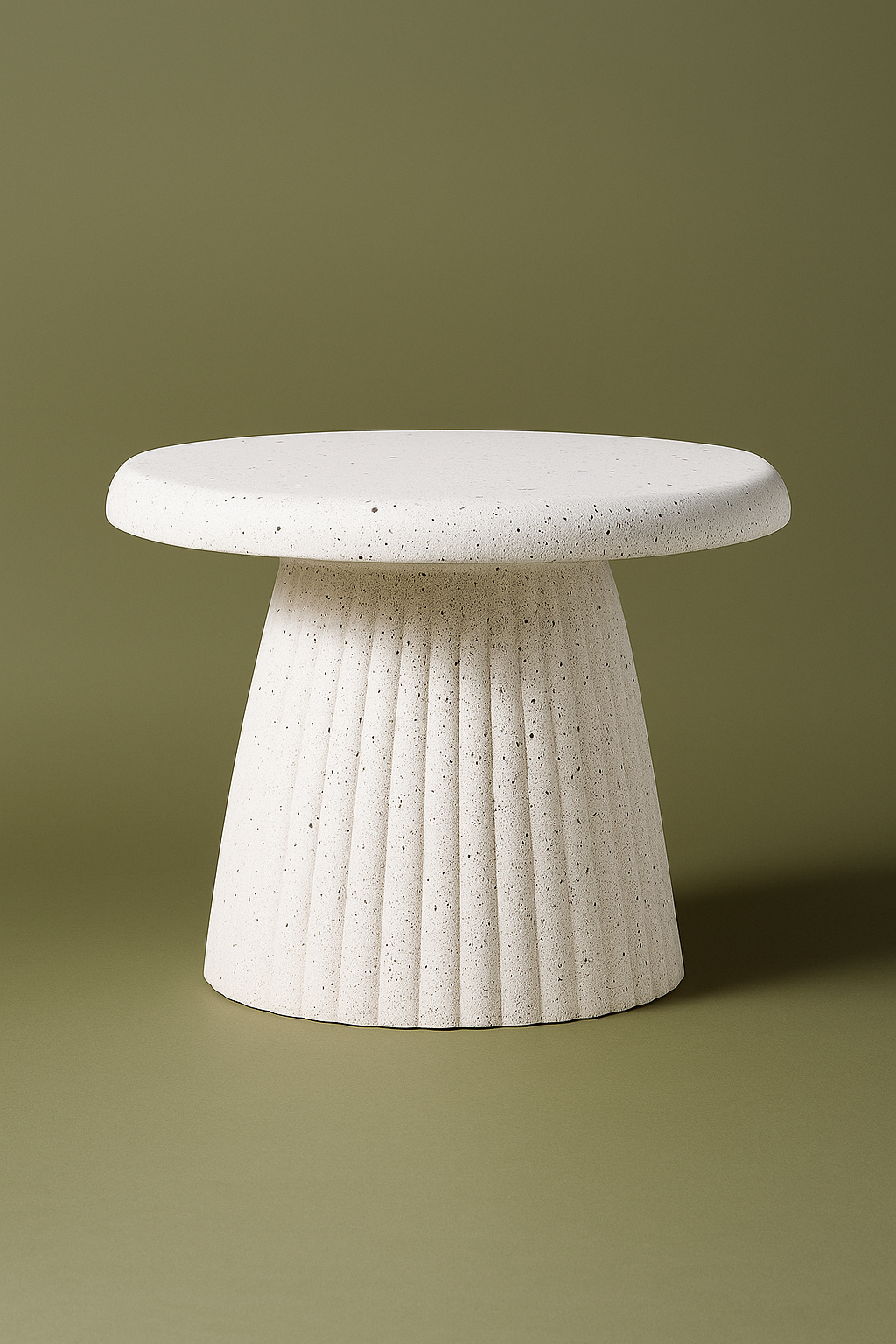 Modern sculptural side table crafted with a textured concrete finish. Featuring a sleek round top and fluted base, this statement piece blends durability with contemporary design. Dimensions: