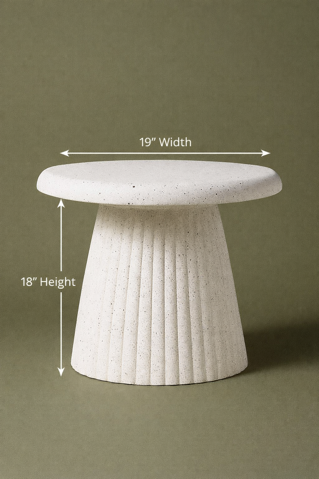 Modern sculptural side table crafted with a textured concrete finish. Featuring a sleek round top and fluted base, this statement piece blends durability with contemporary design. Dimensions: