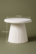 Modern sculptural side table crafted with a textured concrete finish. Featuring a sleek round top and fluted base, this statement piece blends durability with contemporary design. Dimensions: